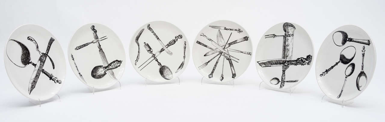 An early set of six plates by Piero Fornasetti.
