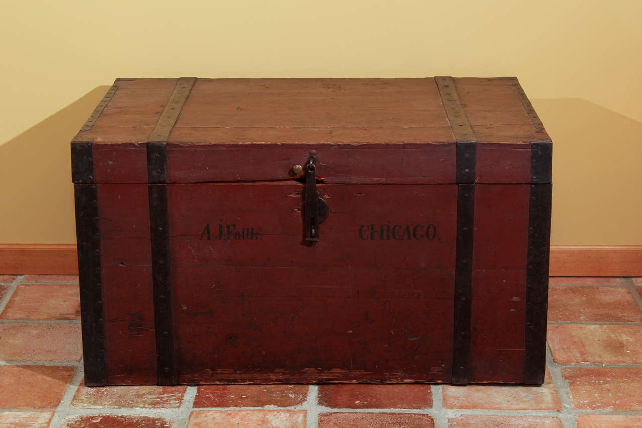 Swedish Immigrants Trunk with original paint

This is a unique trunk with the original markings into Chicago.  It has wonderful iron handles and banding.  

It has a nice flat top so it would work well as a coffee table and it has good storage