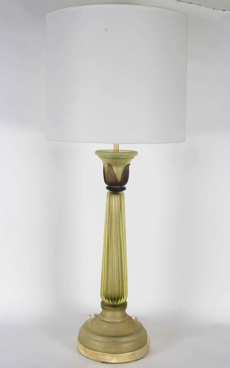 Fantastic pair of celery green Scavo glass lamps with dark green glass accents on satin brass bases. Glass manufactured by Seguso for The Marbro Lamp Company.