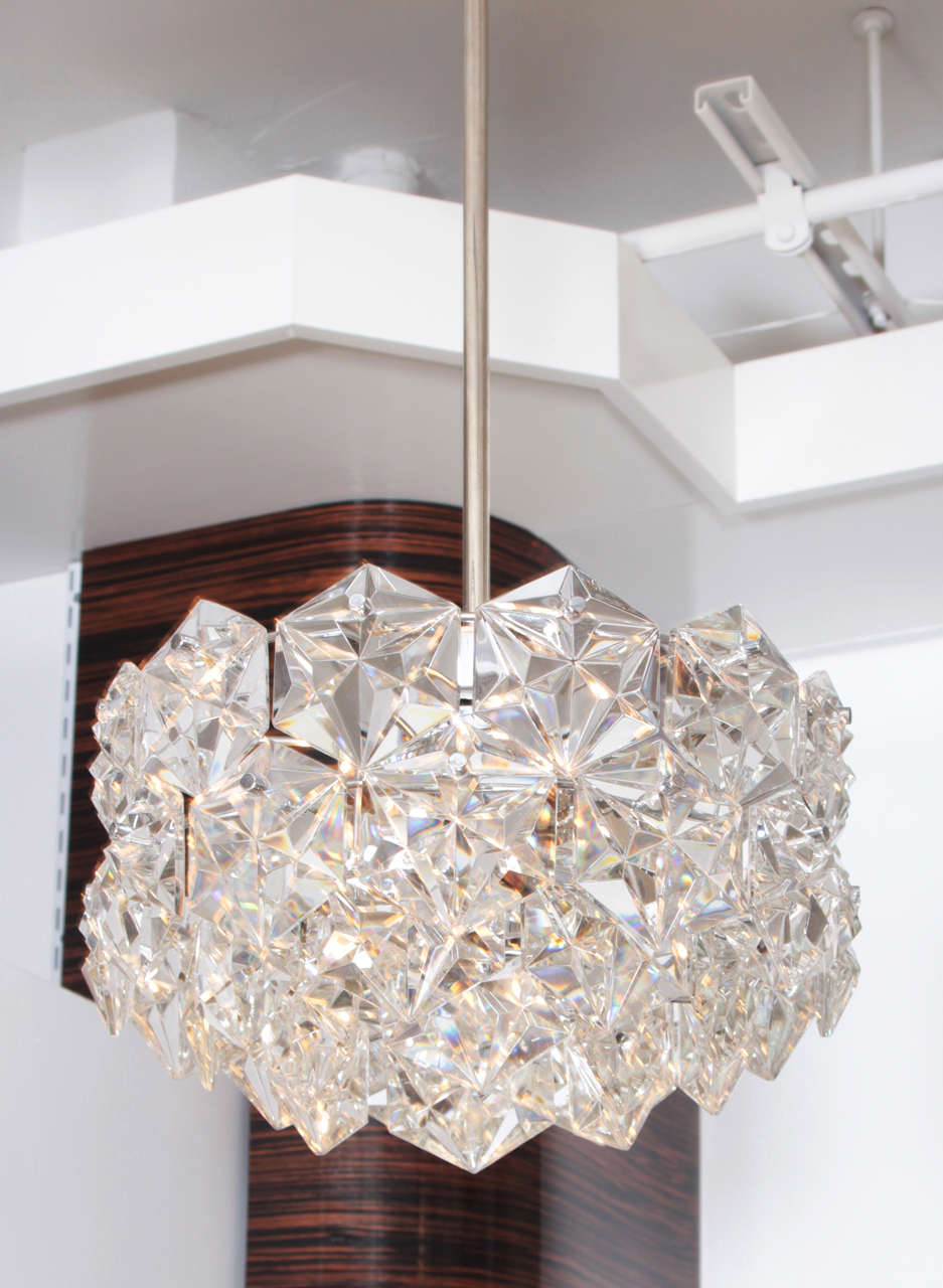 Fantastic 3 tier faceted crystal prism chandelier on a polished nickel stem and frame. Perfectly scaled for a glam powder room or bedroom. Crystal body measures 11 inches tall.