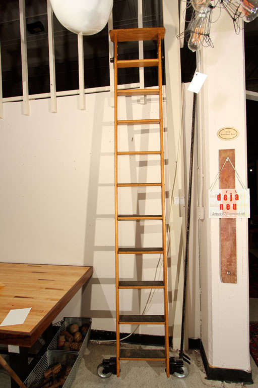 Rolling, oak library ladder, with 8 foot section of rail