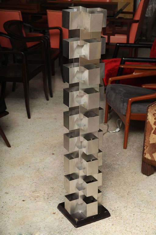 The geometric metal stacked sections on an ebonized base.