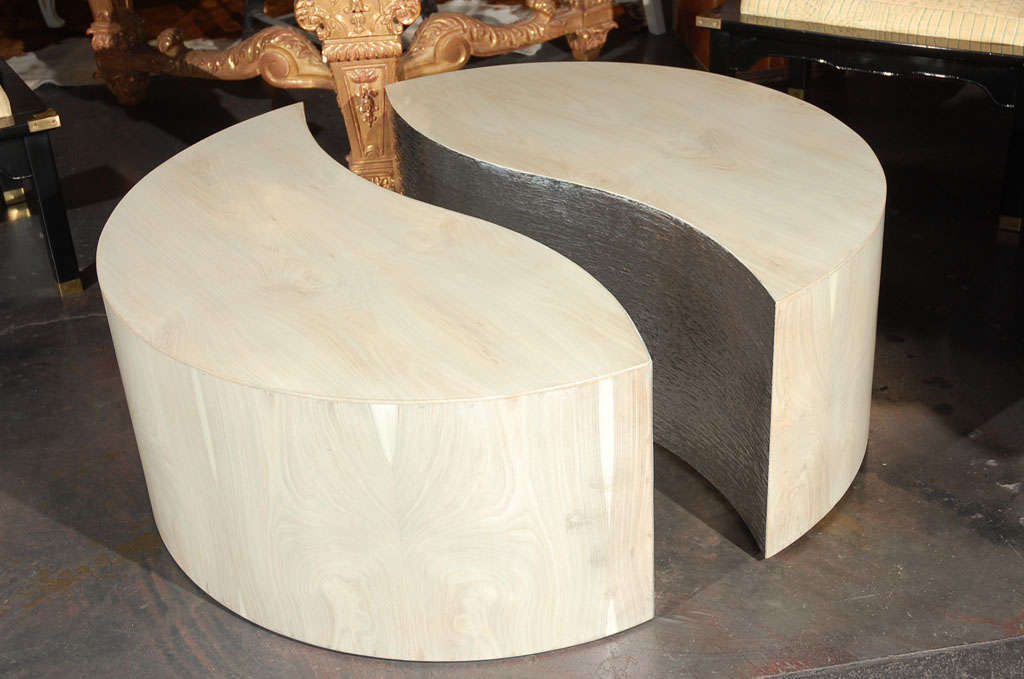 A striking pair of bleached cherry curved half moon coffee table. Interior sides are lined with a 