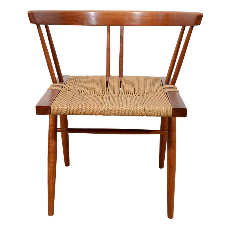 A George Nakashima Walnut and Grass Studio Chair.