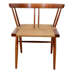 A George Nakashima Walnut and Grass Studio Chair.