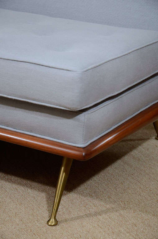 A T.H. Robsjohn-Gibbings Upholstered Sofa on Brass Legs. 6