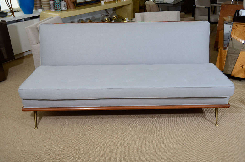American A T.H. Robsjohn-Gibbings Upholstered Sofa on Brass Legs.
