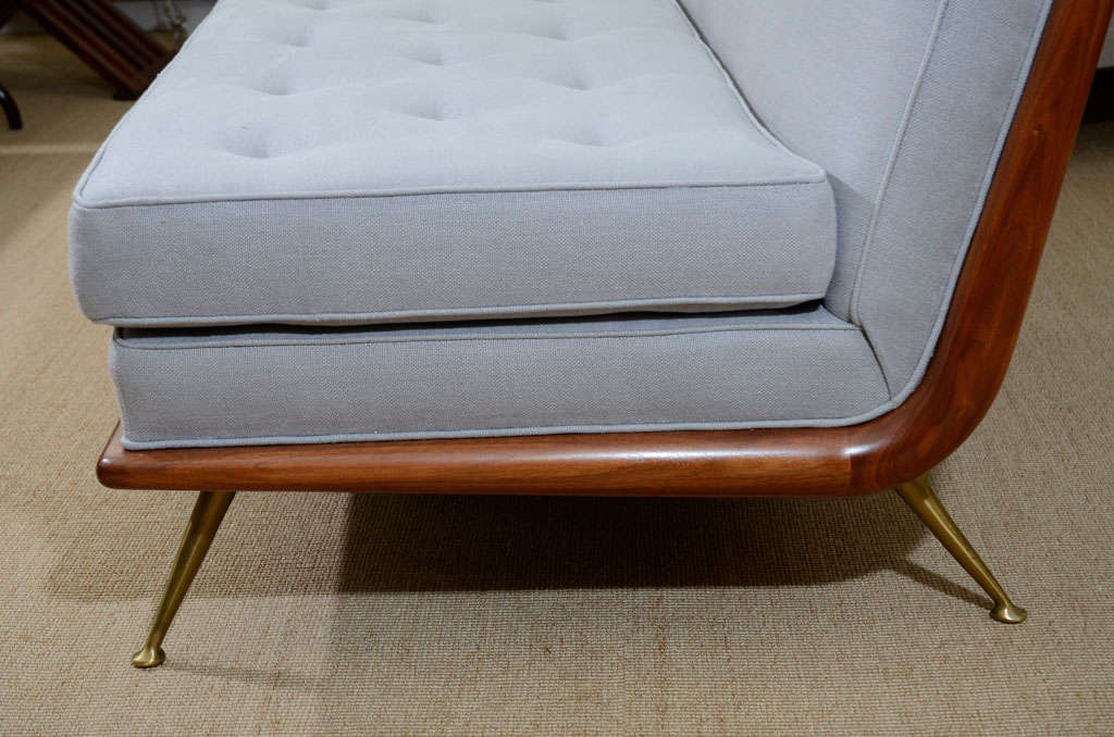 A T.H. Robsjohn-Gibbings Upholstered Sofa on Brass Legs. 2