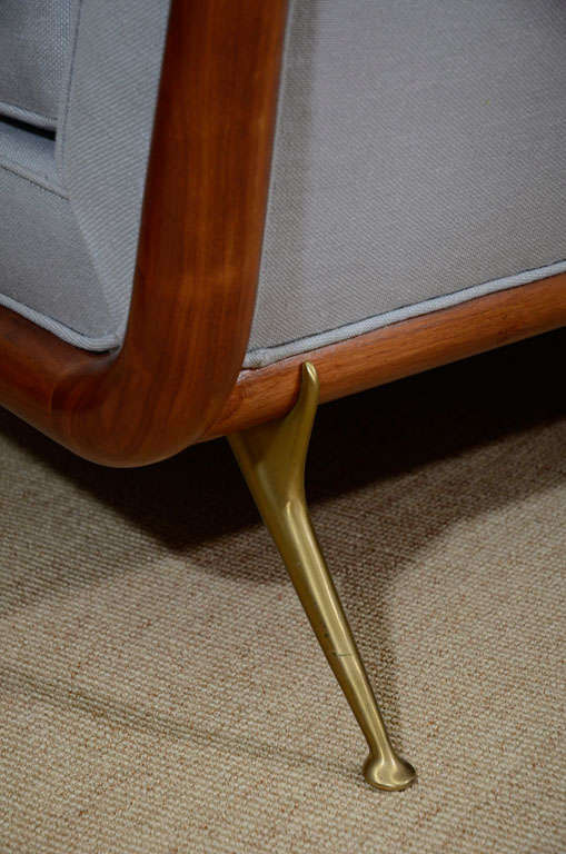 A T.H. Robsjohn-Gibbings Upholstered Sofa on Brass Legs. 5