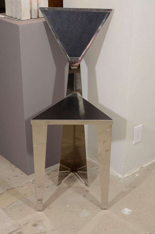 Sculptural, this well crafted mirror polished stainless steel chair with triangle and geometric design is a piece of art. Seat is a black textured enamel.