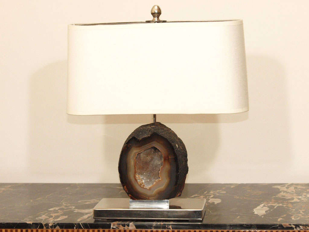 Table lamp with two lights; the sectioned geode mounted to a rectangular nickel plated base; measurements include the original shade