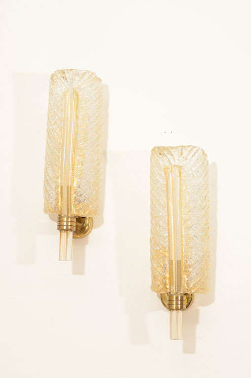 Elegant and sleek murano glass sconces in clear crystal with 24k gold inclusions attributed to Barovier & Toso.  Polished brass base.  Absolutely beautiful in any decor.

keywords:  Barovier & Toso, Venini, Mazzega