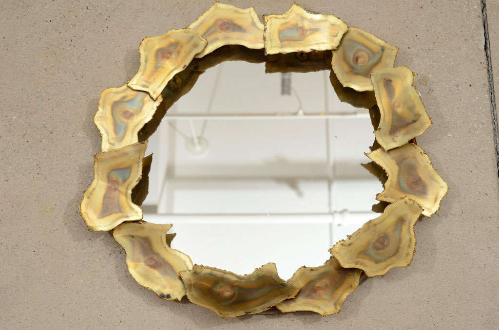 Round brass framed mirror with freeform 