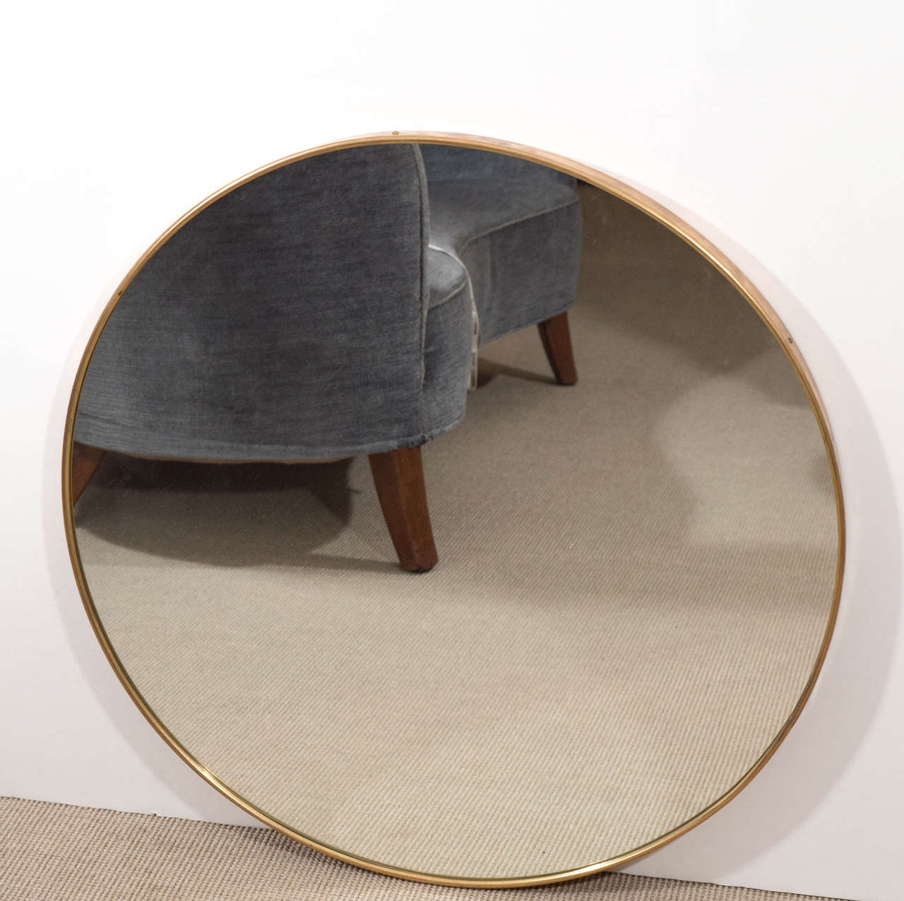 Italian modernist brass framed round mirror, 1950s.