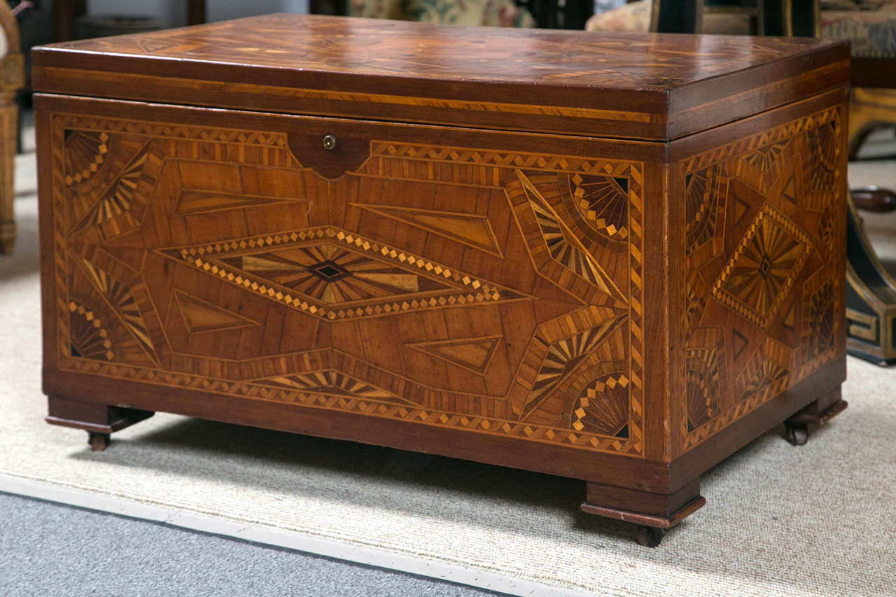 Amazing 19th century Folk Art Sailor's Chest. The exterior of chest is entirely covered with various inlaid woods. The interior has a removable tray which is also completely inlaid, as is the bottom of the interior chest.