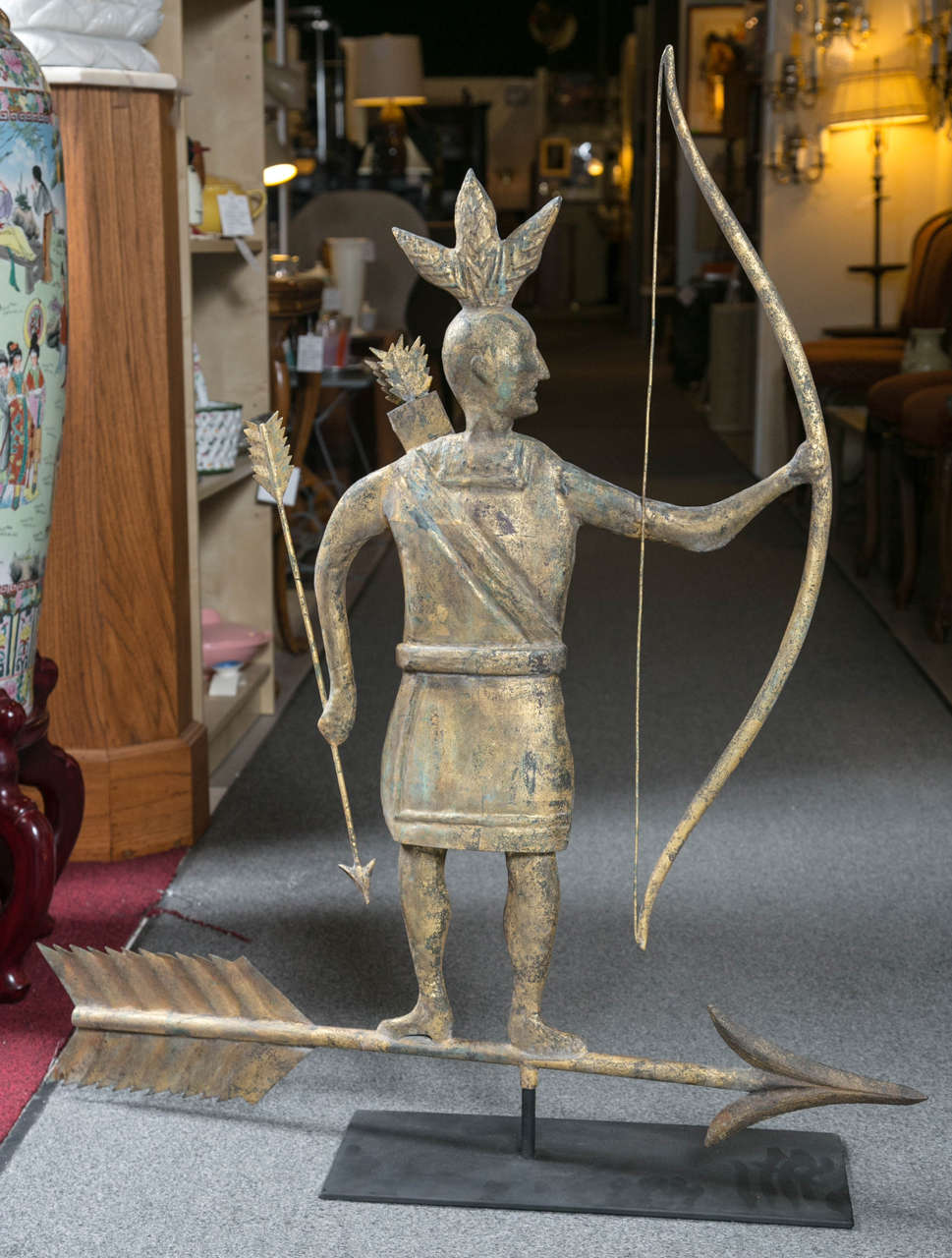 This copper weathervane is the Indian Massasoit who was the peacemaker with the pilgrims.  The arrow pointed down signifies 