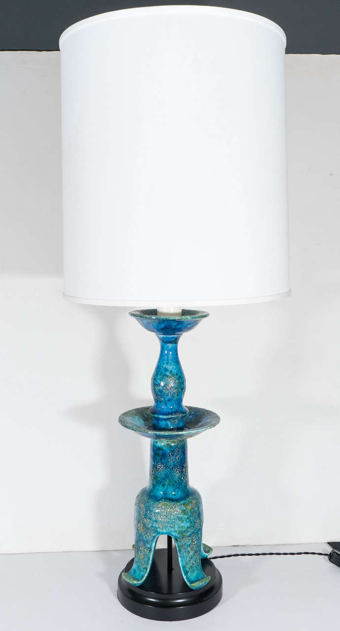 An Italian vintage pagoda lamp, produced circa 1960s attributed to Zaccagnini in iconic 'Rimini Blu' glaze over a textured ceramic surface, on circular black enamel base; lamp shade included. Recent wiring and sockets to US standard, requires two