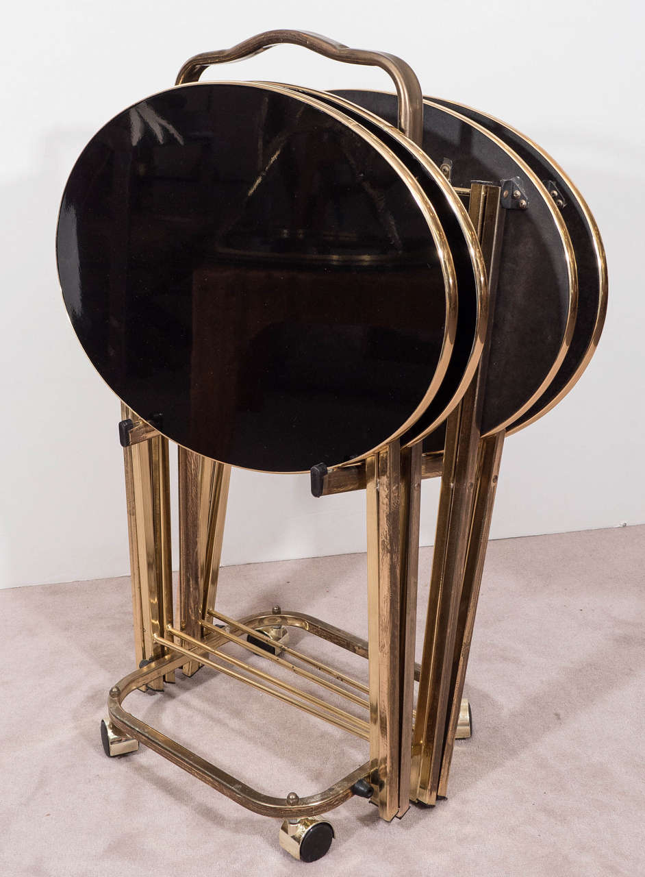 Set of Four Hollywood Regency Brass Frame Dinner Trays with Black Glass Tops In Good Condition In Astoria, NY
