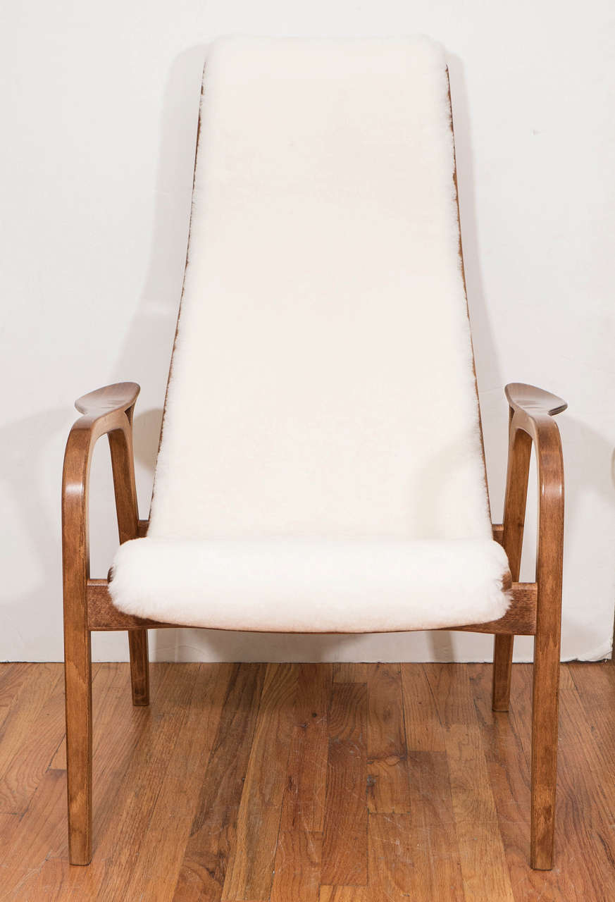 A single circa 1960s Swedish 'Lamino' lounge chair, originally designed by Yngve Ekström in 1952 for Swedese Möbler, with beechwood frames on tapering legs, completely upholstered in sheep wool. Very good vintage condition, consistent with age and