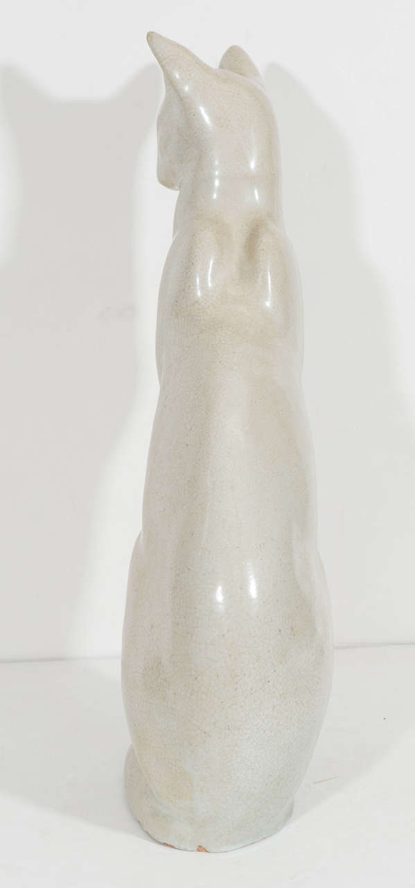 French Art Deco Siamese cat sculpture, in an upright position in white ceramic with 'craquelure' (crackle) glaze. Good vintage condition, consistent with age and prior use. One Cat only! 