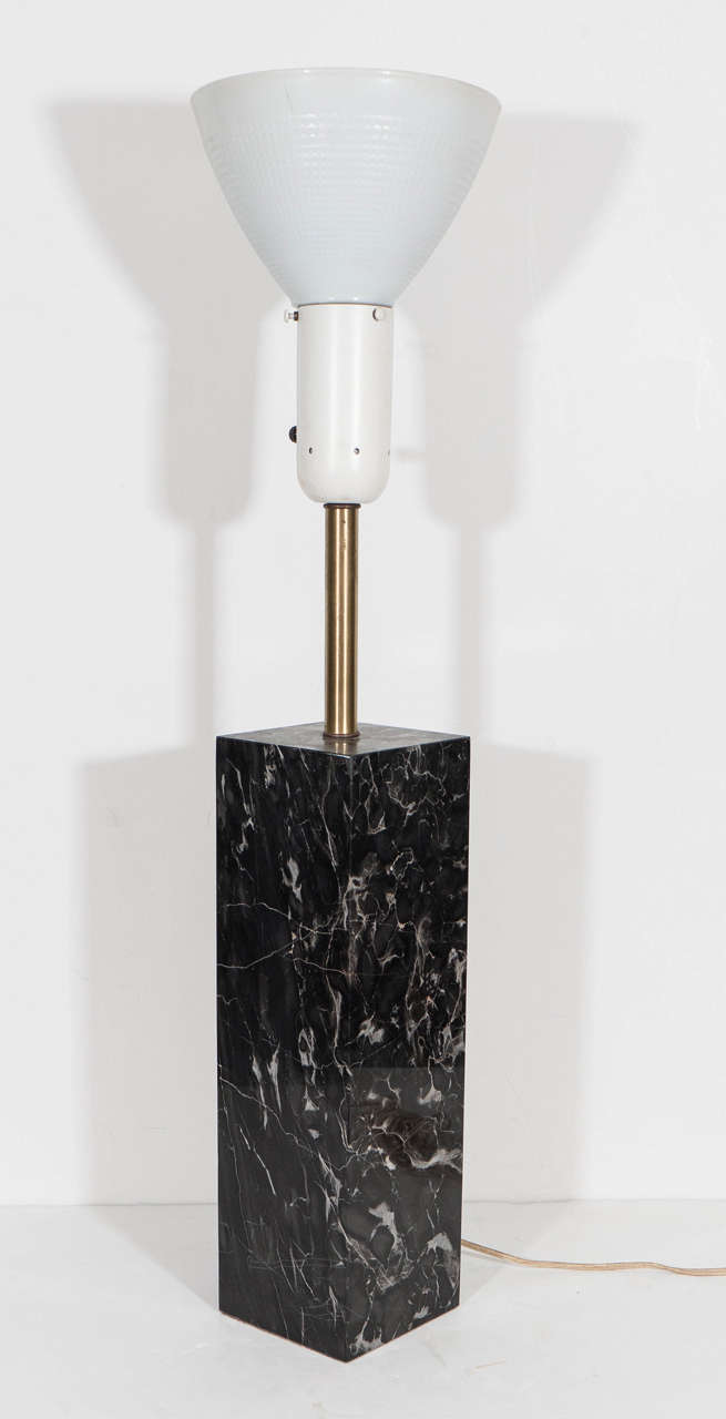 A vintage table lamp, produced by Nessen Studio, with inverted milk glass lamp shade and white diffuser, on rectangular carved black marble stem with white veining, and brass hardware. Original wiring and socket to US standard, requires one Edison