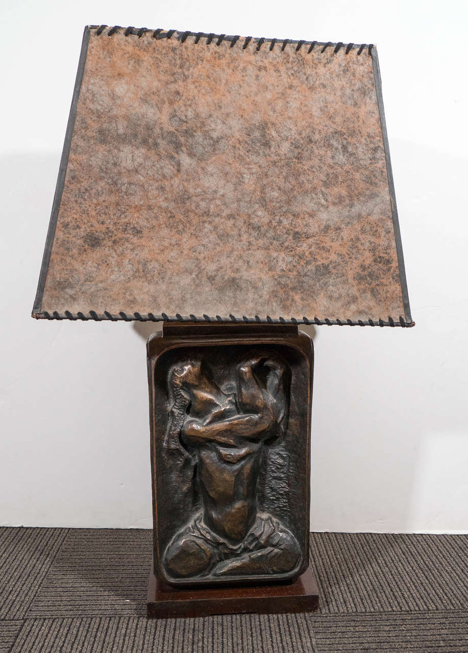 A great sculptural table lamp, produced in 1945 by American artist Hugo Robus (1885-1964) for Silas Snider & Co. (part of a limited edition series), with double cluster sockets and pull chains above a rectangular form bronze body, decorated with
