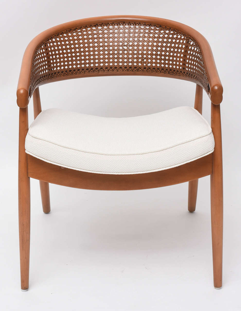 Famously used in Mont's design for the King Cole penthouse in Miami. Horseshoe wood frame with hand-woven cane back. Professionally re-finished and upholstered in a soft white cotton pique.