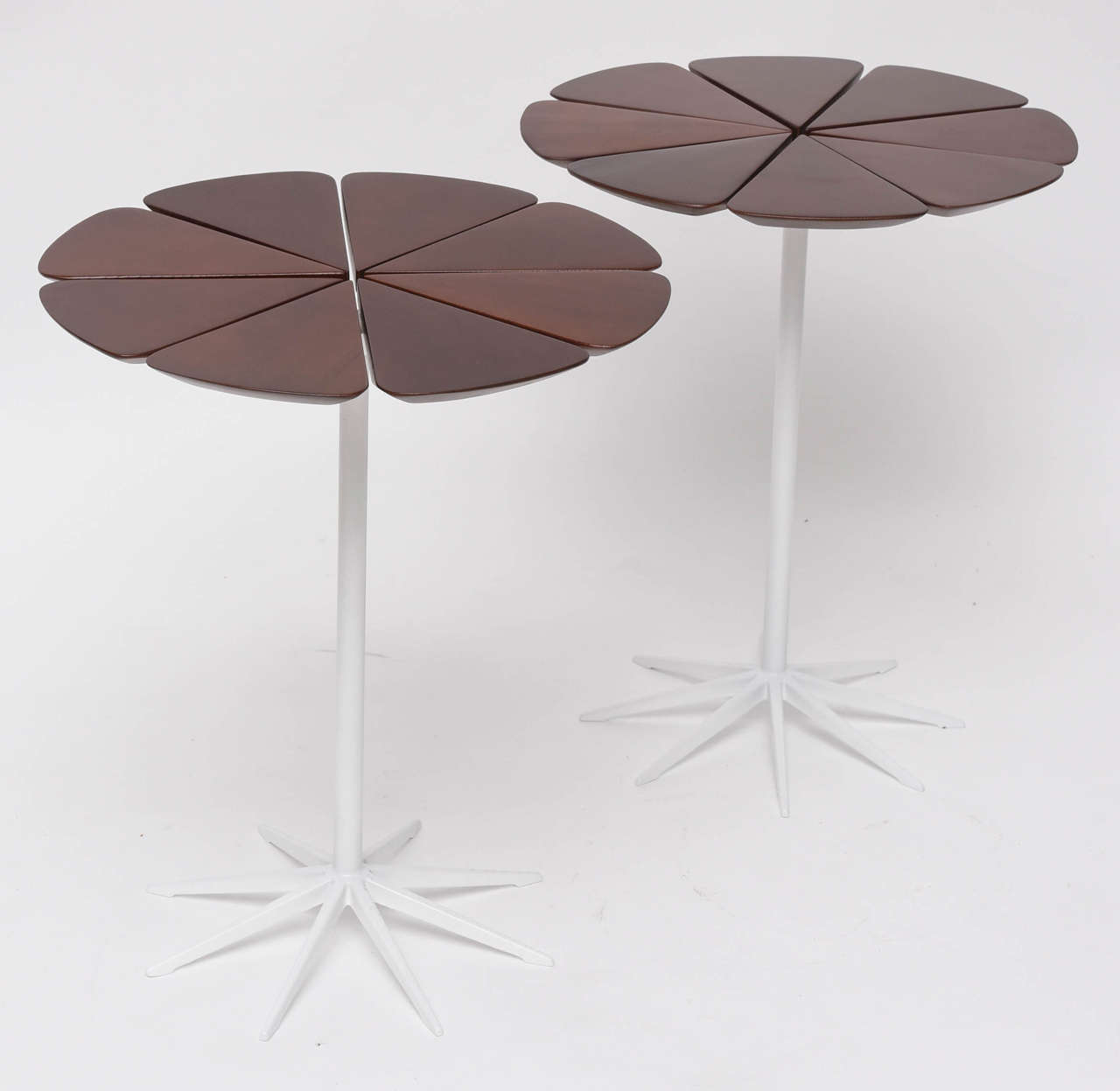 Always fresh and charming! Early pair of Knoll petal tables by Richard Schultz with white enameled bases and redwood tops. Over-sprayed remains of original label on one table. Restored.