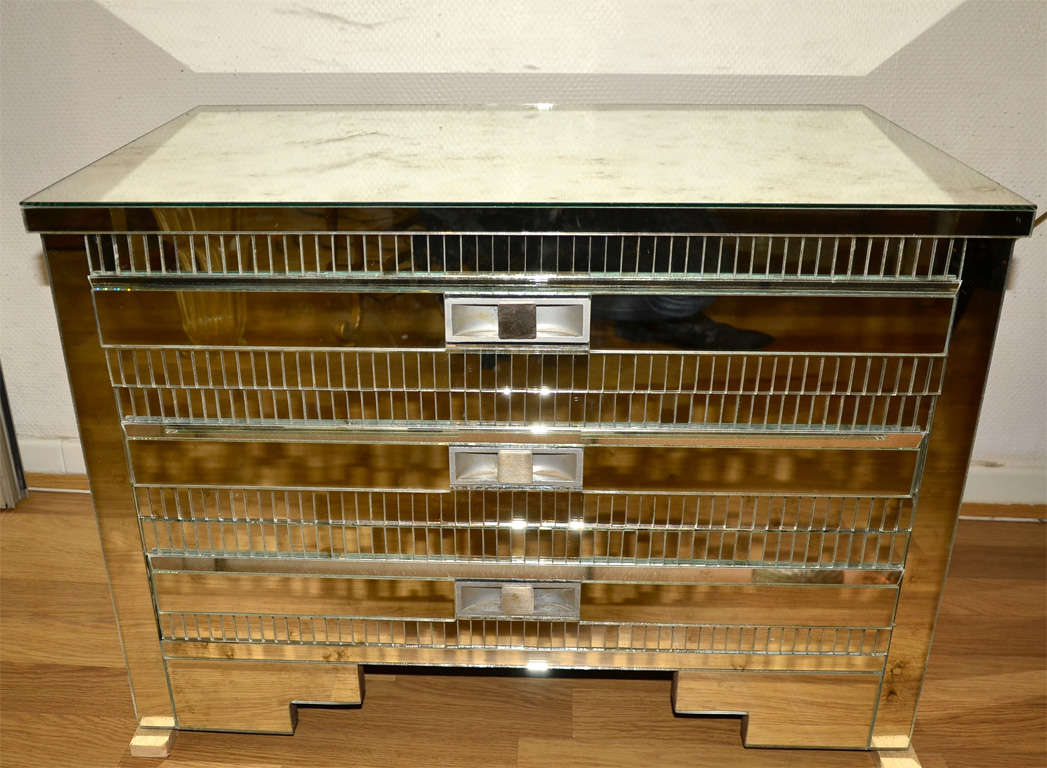 Pair of commodes in mirror.