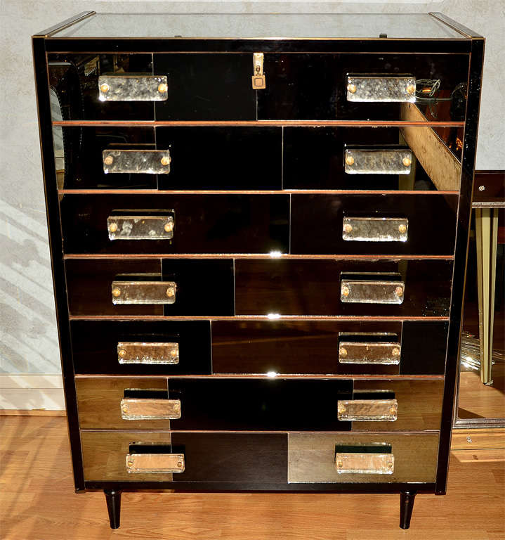 Commode with 7 drawers all in mirror.