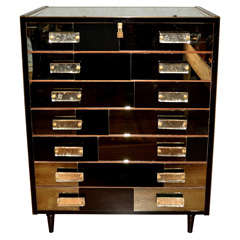 Commode with 7 drawers all in mirror.