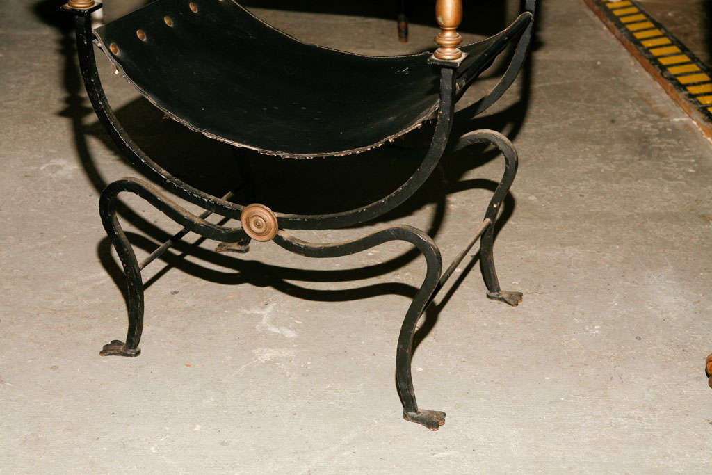 Pair of classical style Italian Savonarola chair in iron and brass and leather sling.

Keywords:  directoire chair, armchair, bergere, club chair, boudoir chair, desk chair, Italian renaissance style chair, empire style chair, savonarola chair,