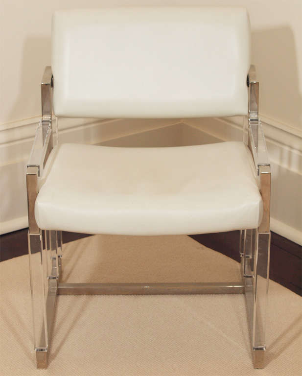 "Metric Line" chair and ottoman by Charles Hollis Jones for Hudson Rissman, c. 1968; the frames in beveled acrylic and nickel-plated steel; original white vinyl upholstery; contact dealer for measurements of the ottoman