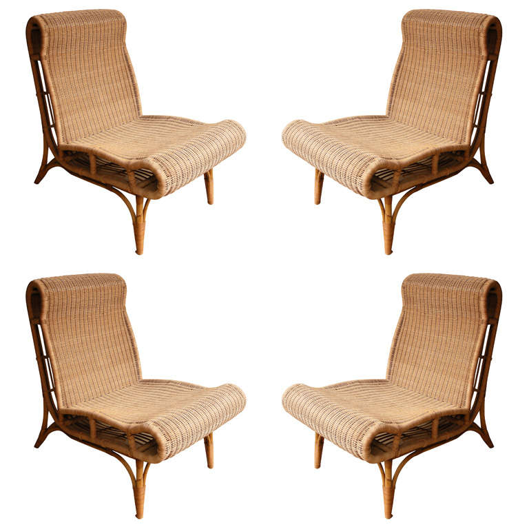 Set of Four Wood and Bamboo chairs by Louis Sognot For Sale