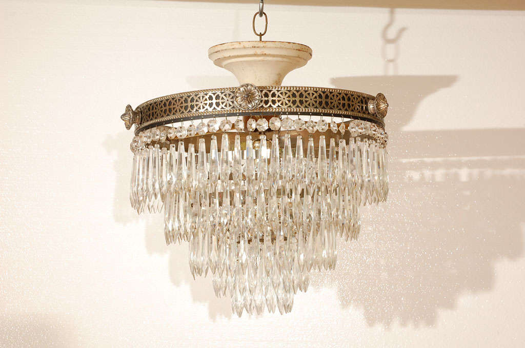 Five layer wedding cake ceiling light with filigree frame and decorative knobs. Single light inside. All crystal are in place and the ceiling cap is original. Frame without knobs measures 12