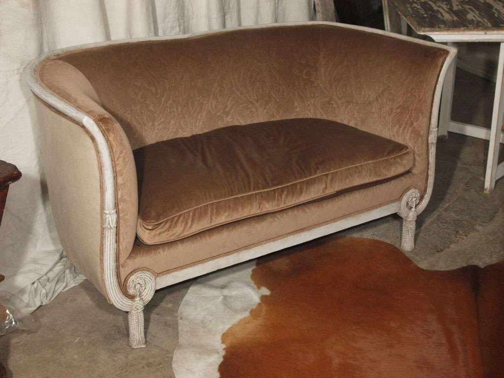 Very unique, this small sofa or settee is hand carved with an interesting 
