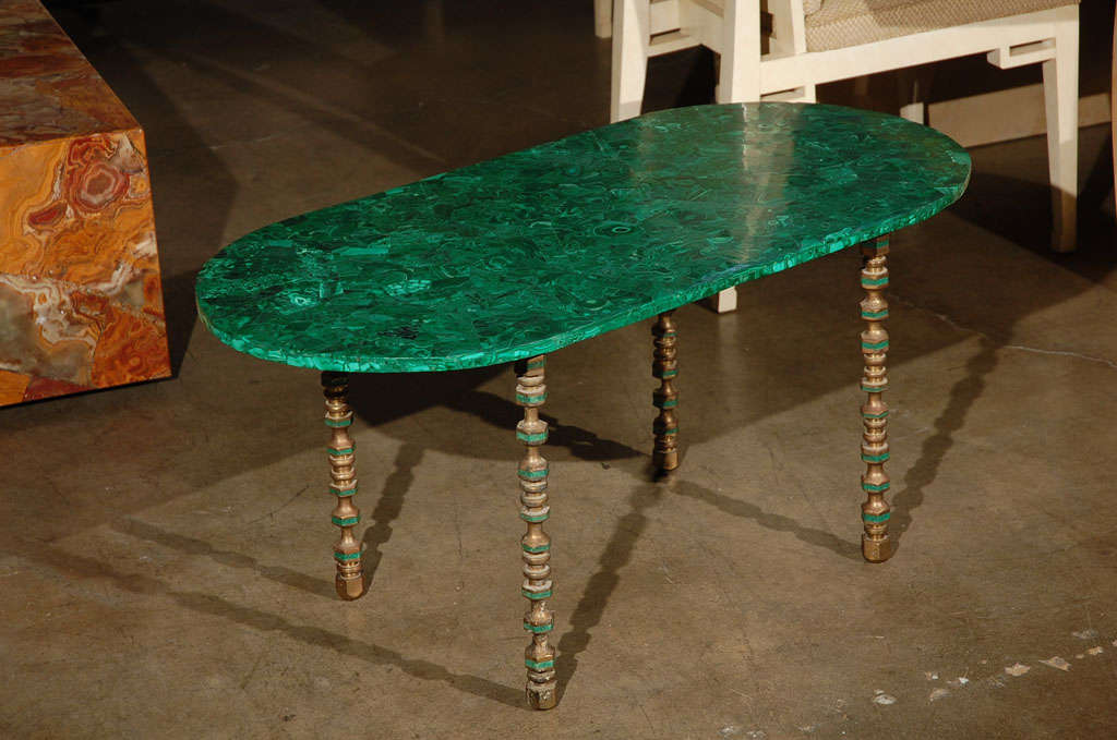 Malachite table with intricate pattern & leg detail.