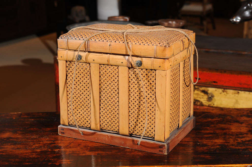 Japanese storage basket from Kyoto made of weaved bamboo, original metal fittings and rope, Taisho period, circa 1920s.