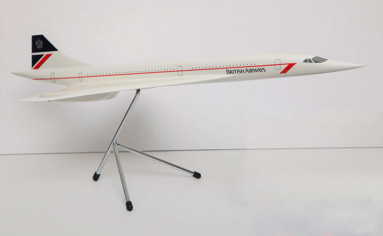 Group of Concorde memorabelia to include: Original desk model.  Sterling silver, English money clip, Sterling silver 10th Anniversary luggage tag, painted metal Concorde letter opener presented on the first flight.