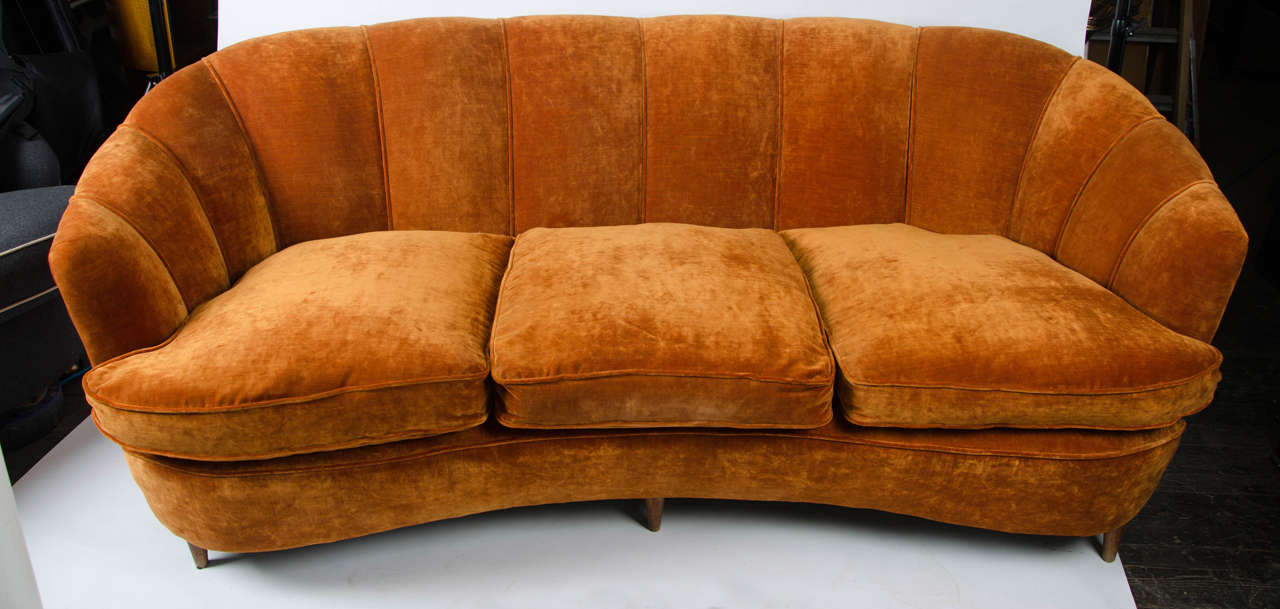 1940's Italian sofa and two armchairs upholstered in orange velvet on wooden feet