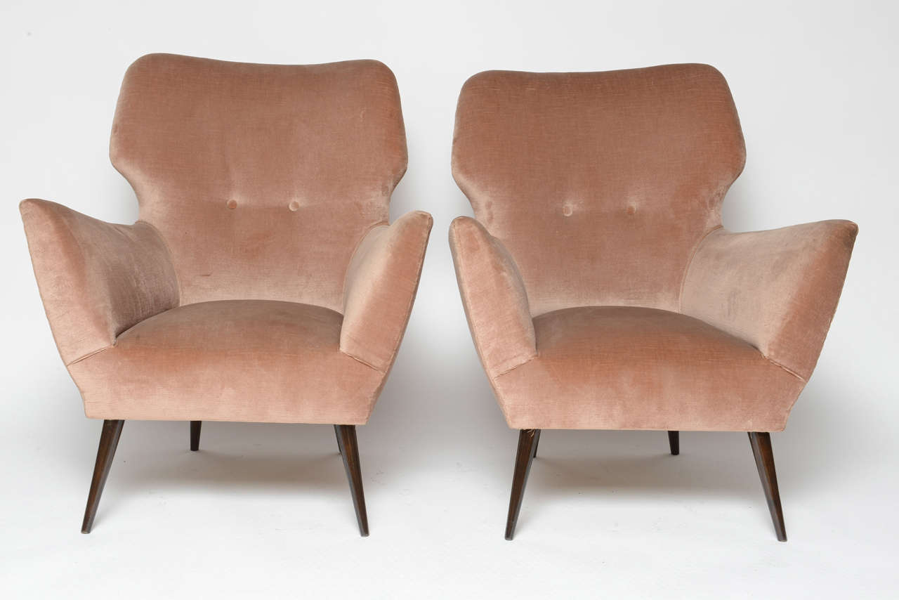 In original velvet and long tapering wood legs, these artful created Italian armchairs are comfortable and sturdy.