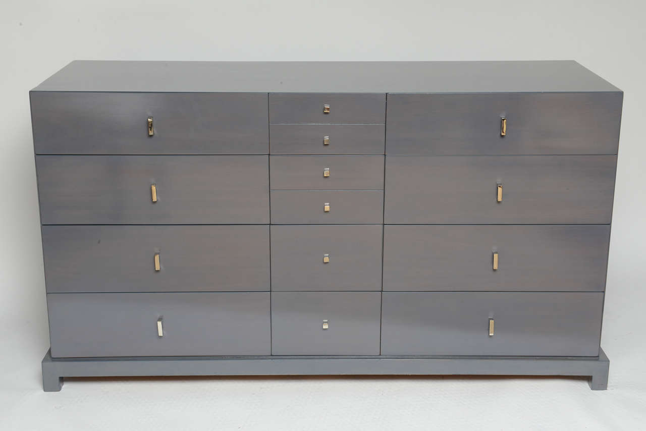 Fully restored in this lovely grey on wood lacquer with high polished original nickel hardware. 14 drawers provide ample storage.