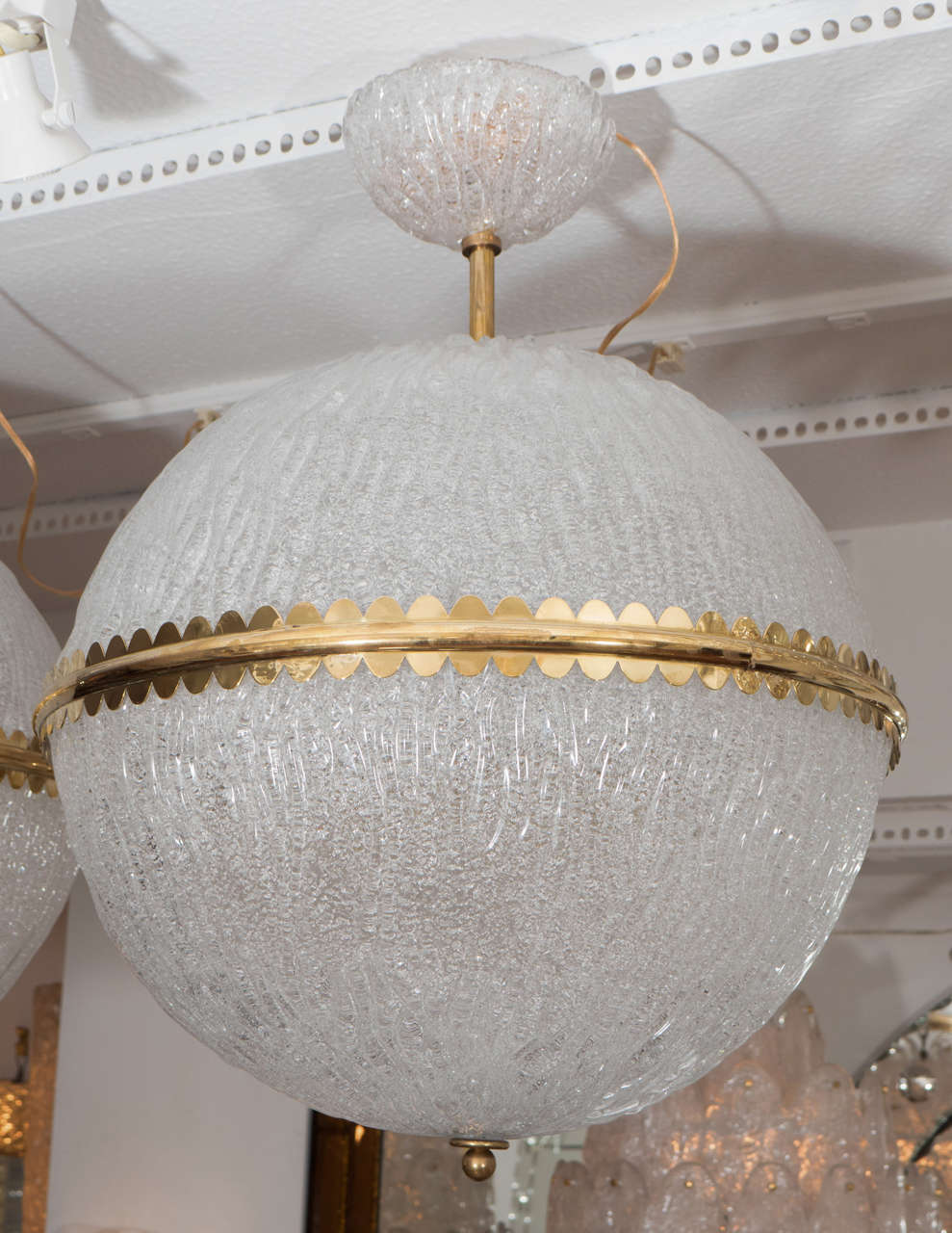 Spherical, striated glass pendants ceiling fixture with brass details and original glass canopy by Barovier. Smaller size (17