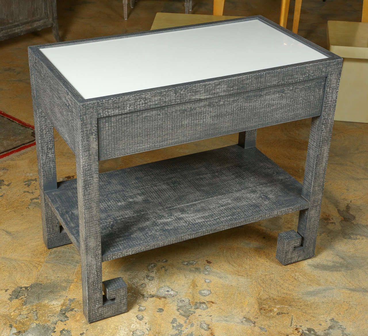 Modern Paul Marra Greek Key Nightstand in custom mottled gray finish and polished white lacquer inset top. One as shown in stock. 