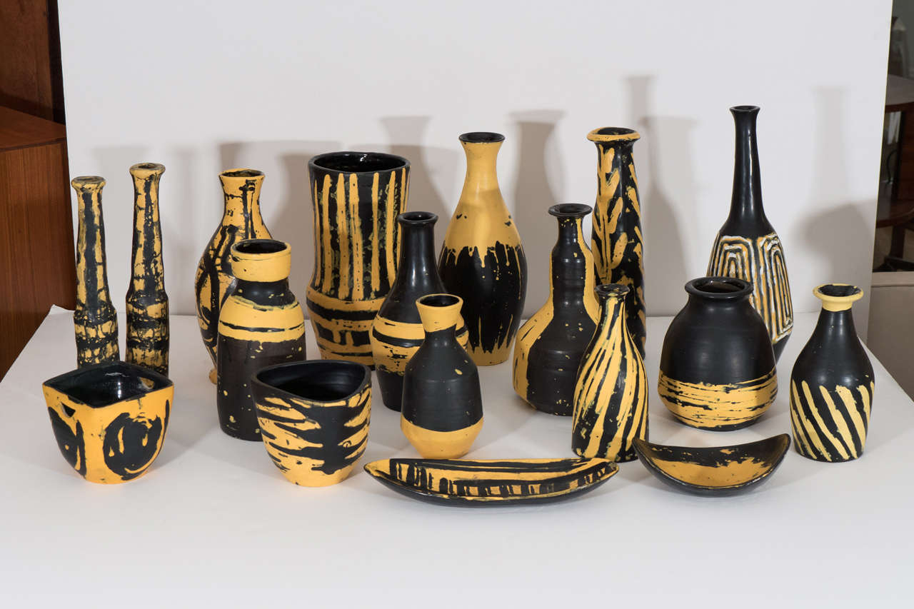All are hand signed.<br />
Heights of these 18 yellow and black ceramics range from 1 3/4
