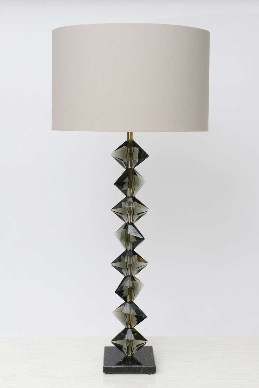We swoon over this glamorous pair of 1950s Italian lamps with unusually shaped, faceted crystals in sexy, smoky grey. Brass hardware and black marble base with white veining. (Shades not included.) Height below is to top of socket.