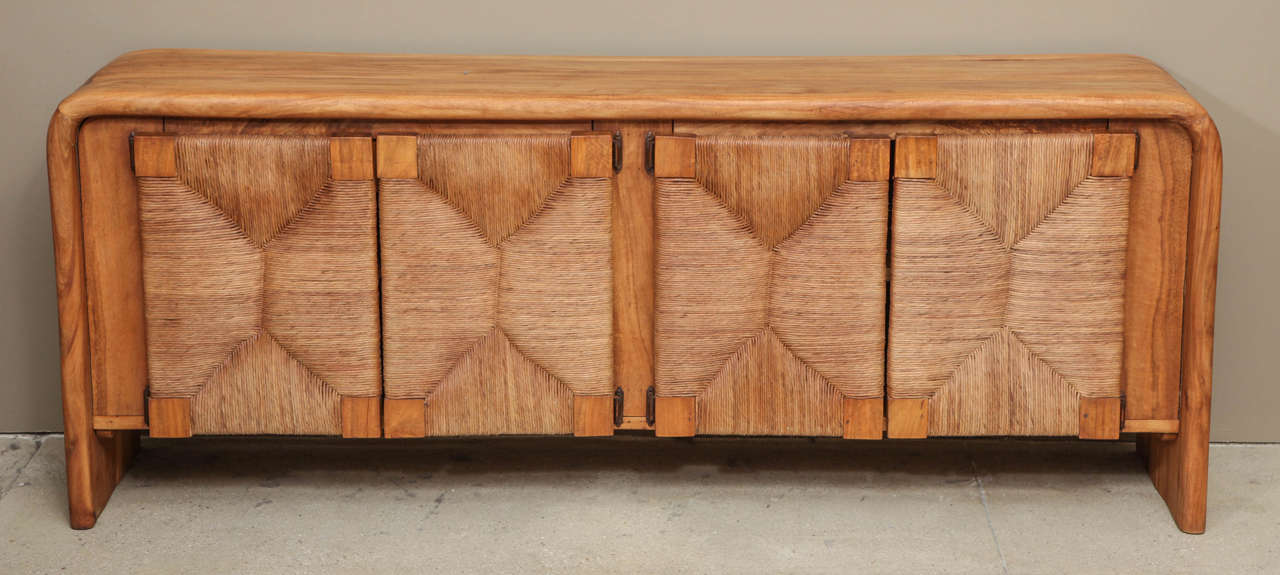 Massive French walnut boards form the body of this cabinet with 