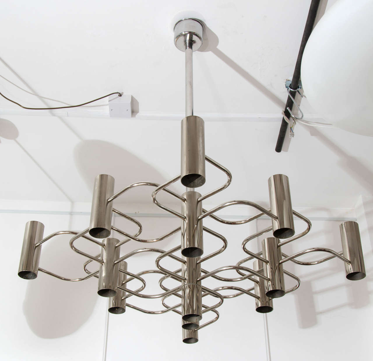 1970s chrome chandelier by Sciolari.
The symmetry of geometrical design is pleasing to look at. 
Good condition.