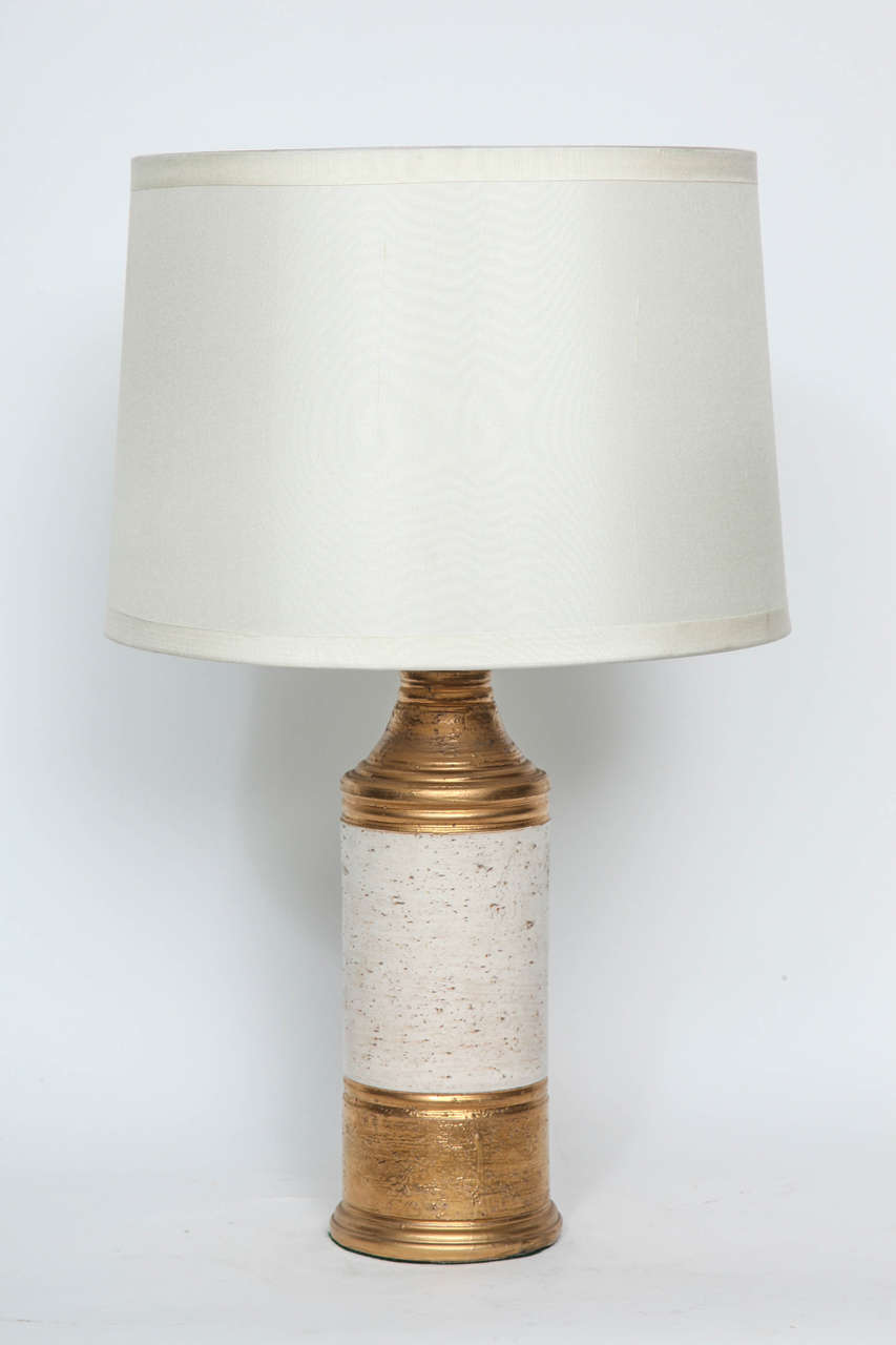 Pair of matte gold glazed ceramic lamps with a 