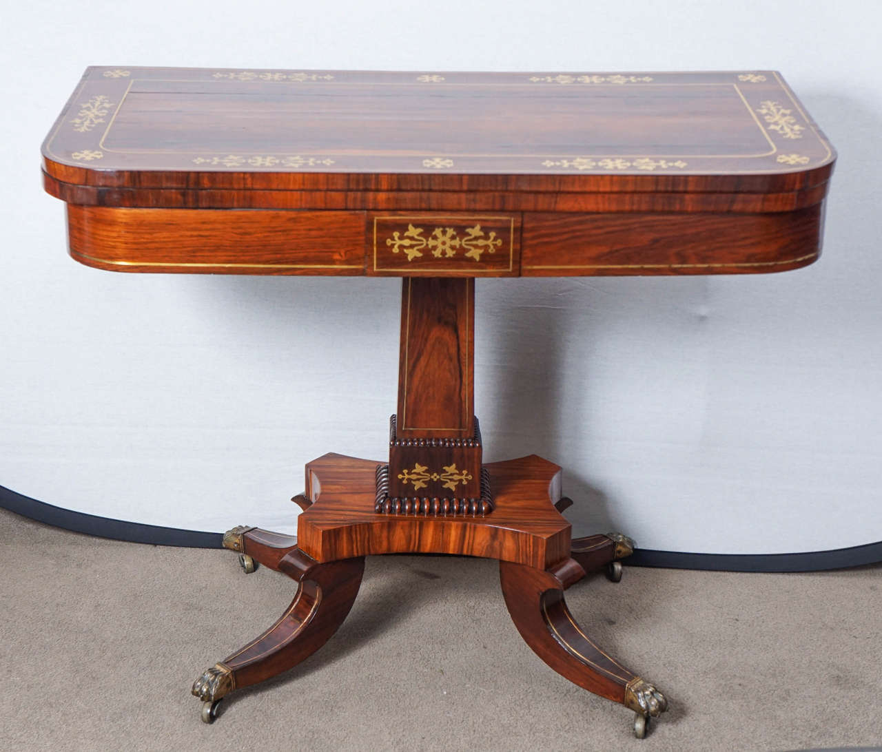 English Regency card table with brass inlay.